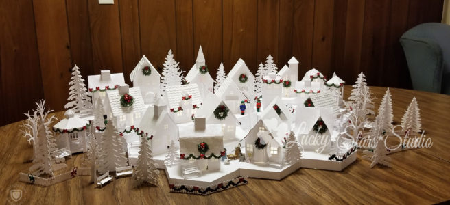 A white paper village sitting on a table